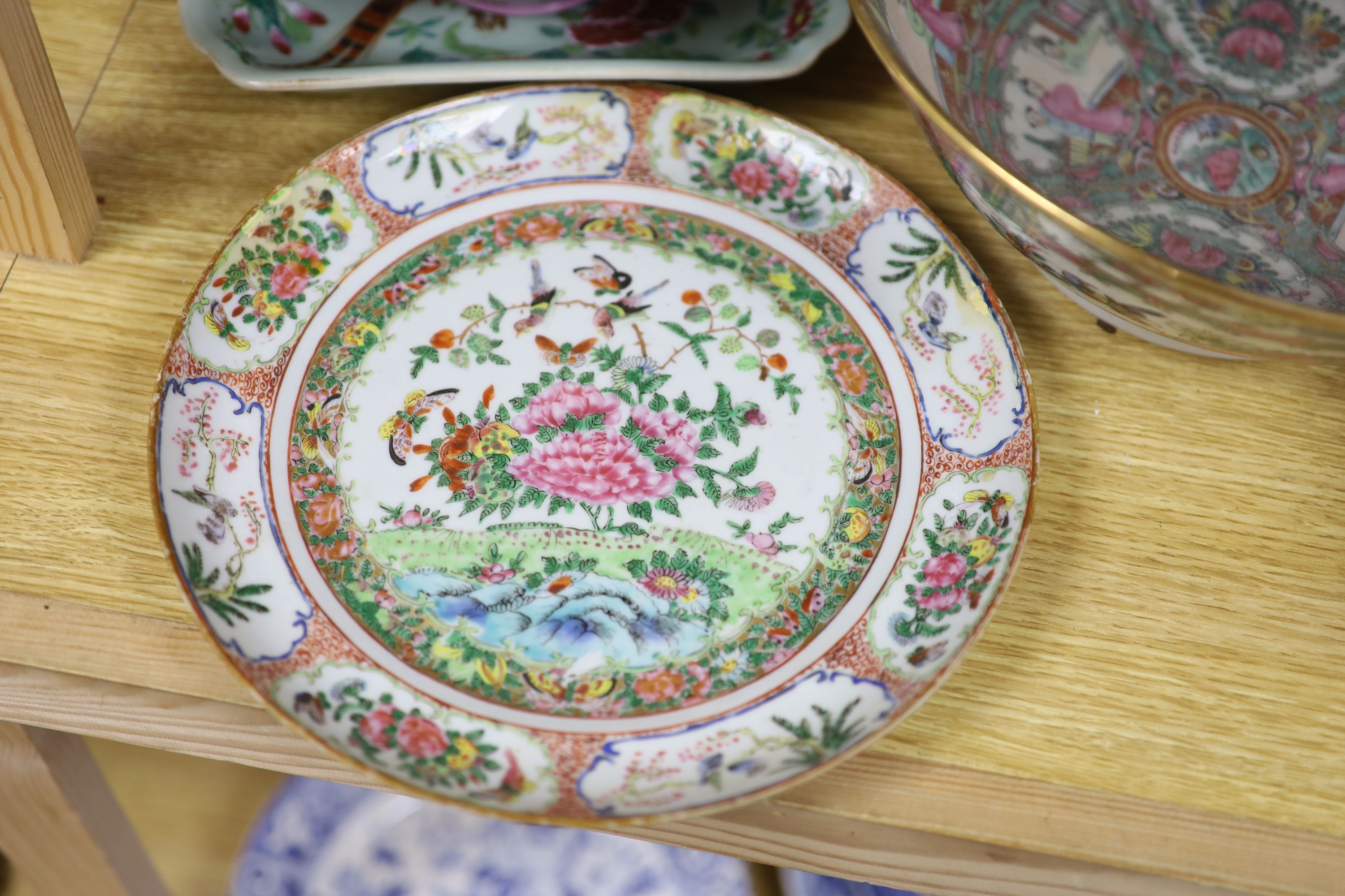 A Chinese pink ground bowl, late 19th century together with two other bowls, a famille verte dish and a plate